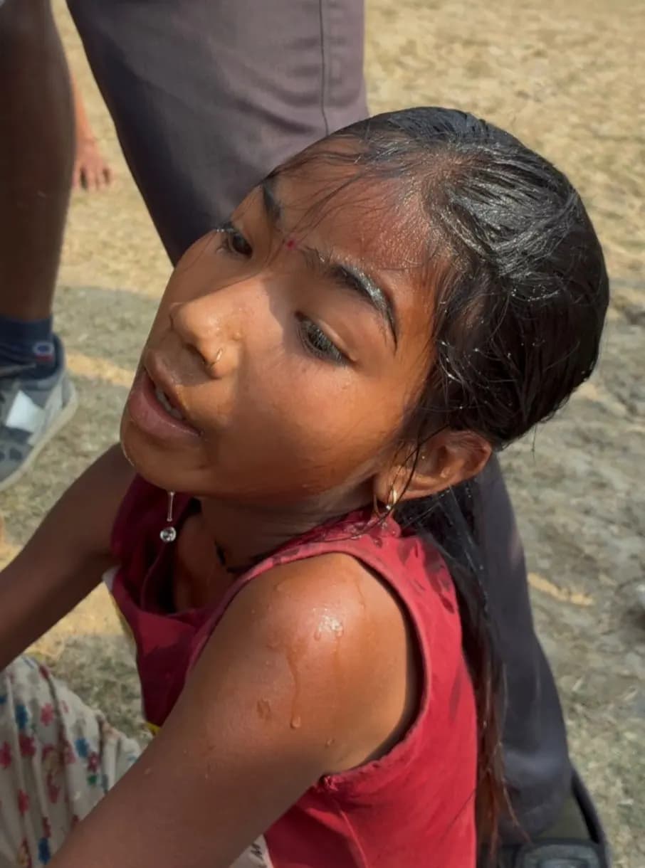 Close-up of a girl runner, hair wet with sweat, just after finishing her race