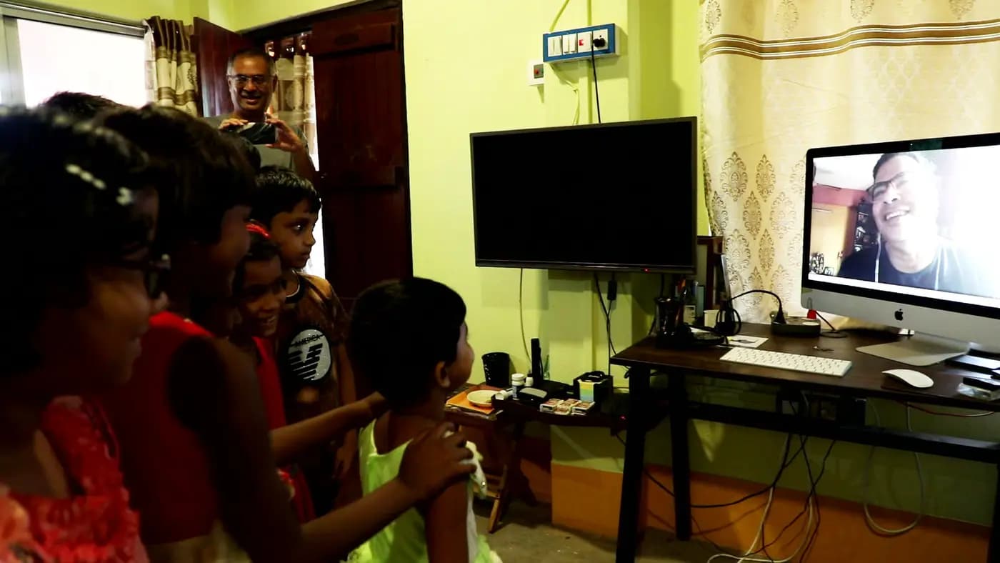 Children watching a video call on a computer