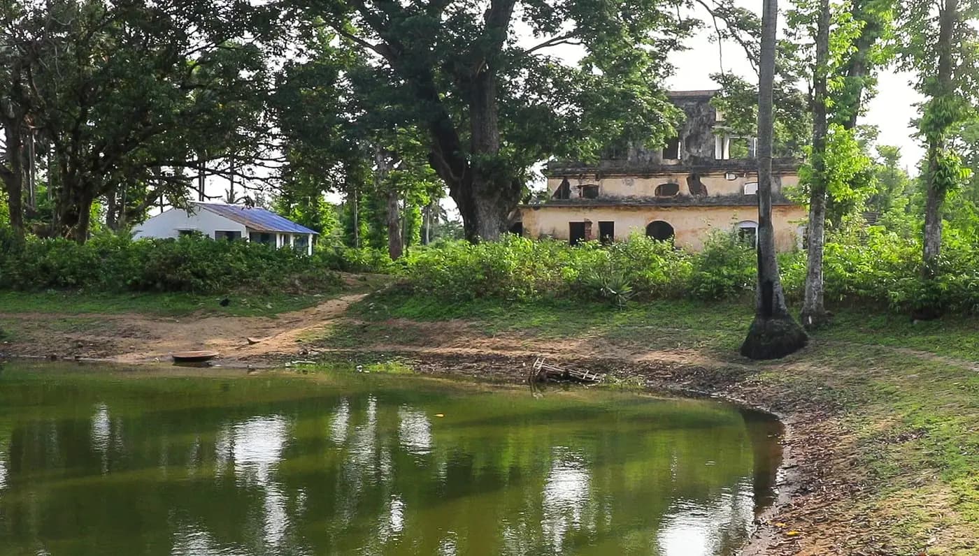 Ruins of the old Khejuri Club House beside a pond