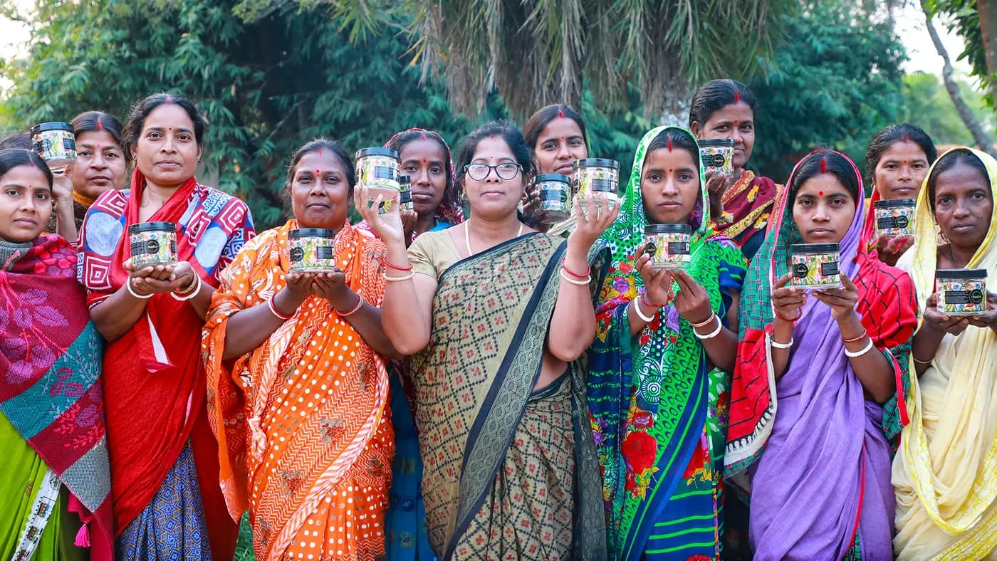 Turiyo Foods women holding up jars of their products