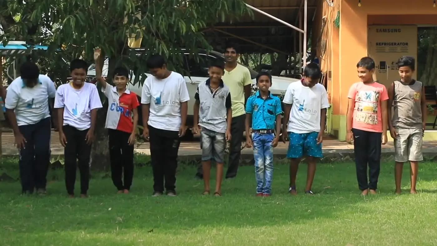Children doing an outdoor group activity on a lawn
