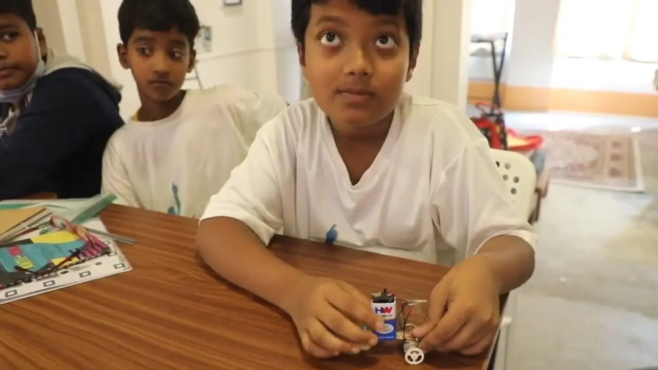 Boy with his battery-powered maker model