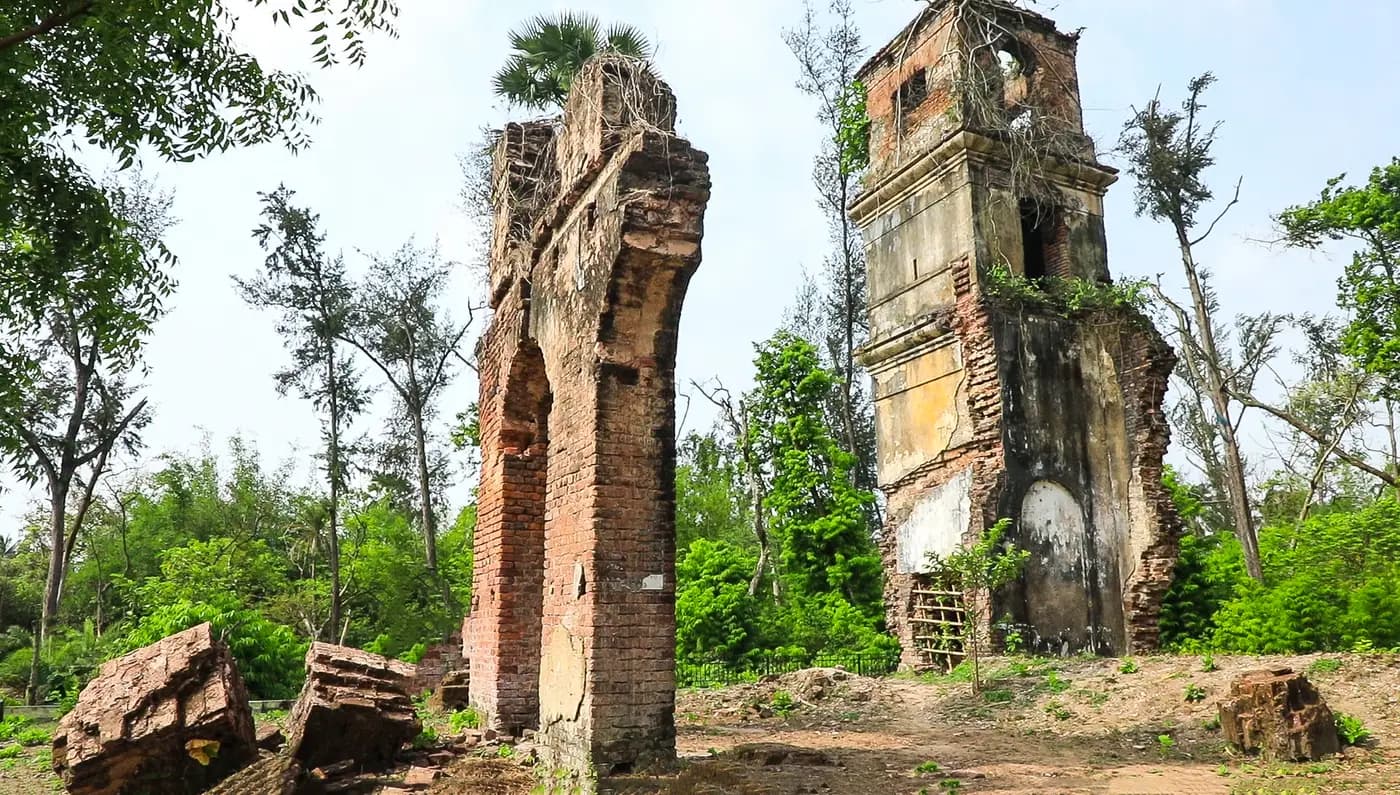 Brick ruins of the old Khejuri post office among trees