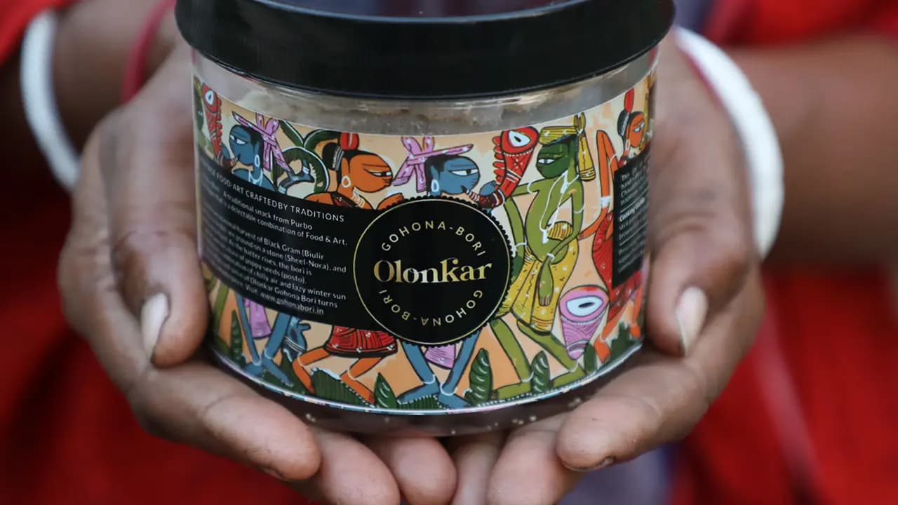 Jar of Turiyo Foods Gohona Bori held in two hands