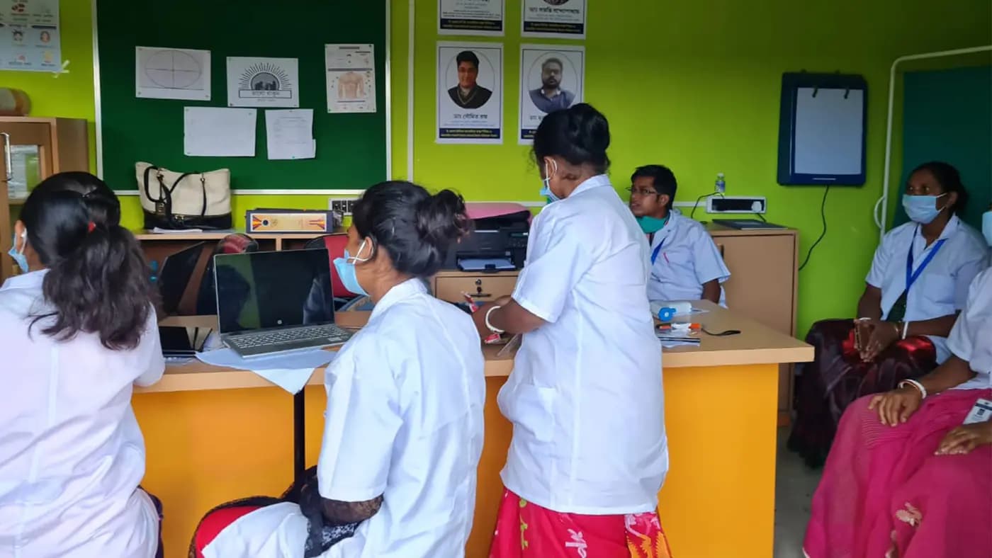 Staff and patients inside the Uday digital health clinic